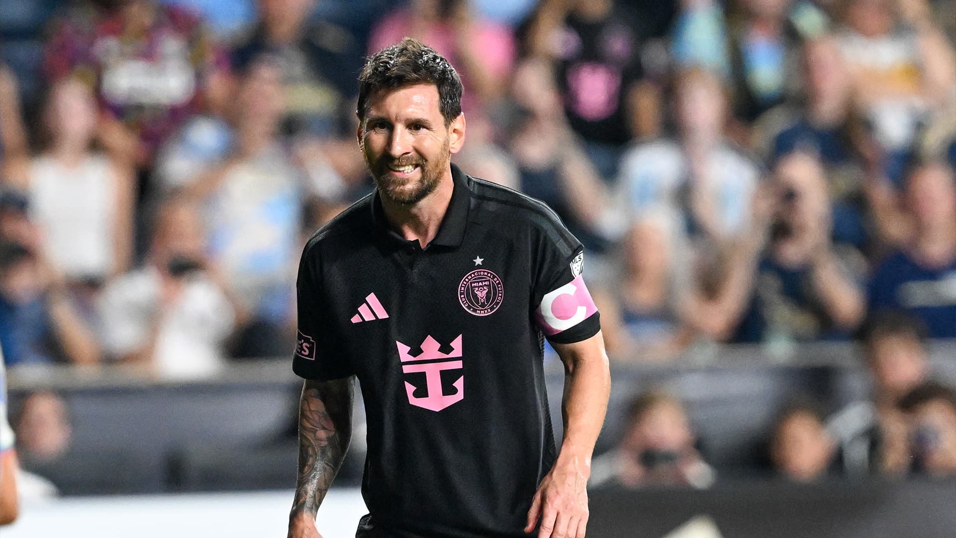 Lionel Messi and Ian Fray during the match, highlighting their fines for on-field conduct violations.