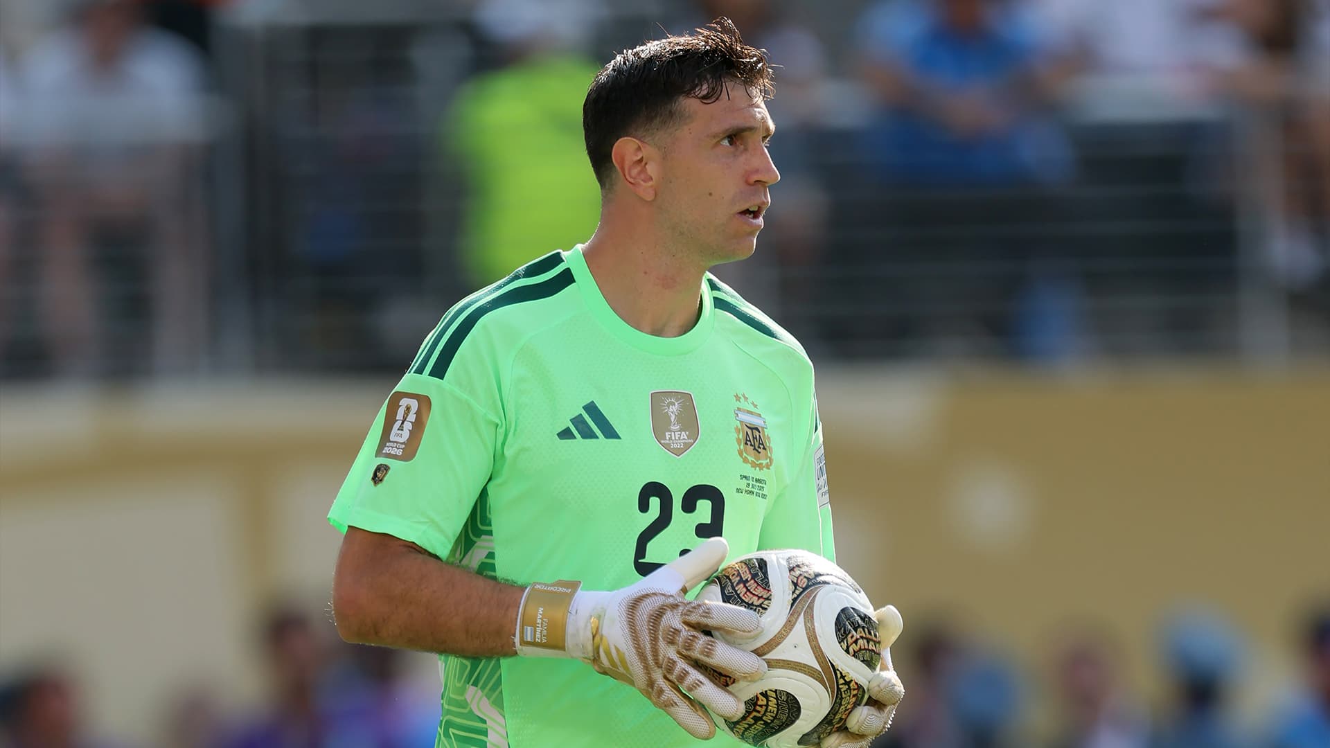 Emiliano Martinez in Chelsea kit, highlighting his transfer from Aston Villa for £7.5 million.