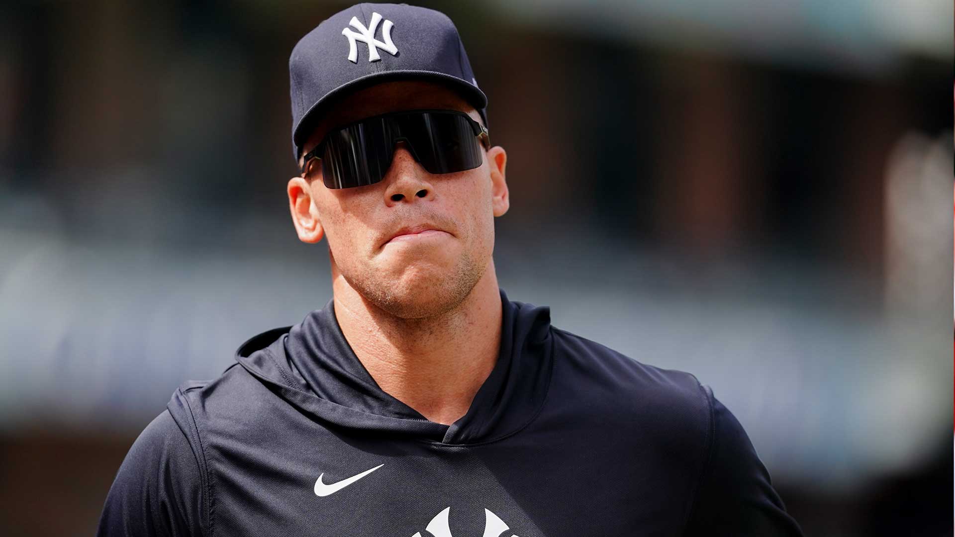 Aaron Judge in Yankees uniform, celebrating his return to the lineup after a rib injury.