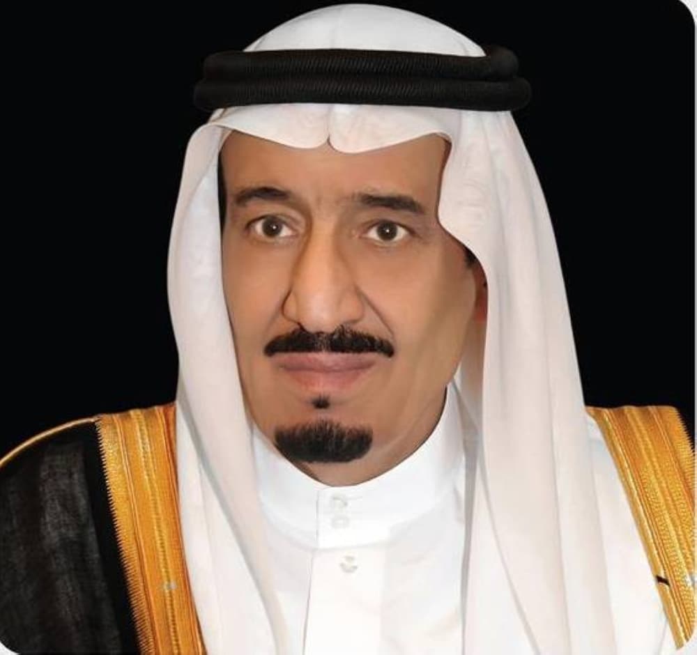 King Salman of Saudi Arabia signing a royal decree for judicial promotions.