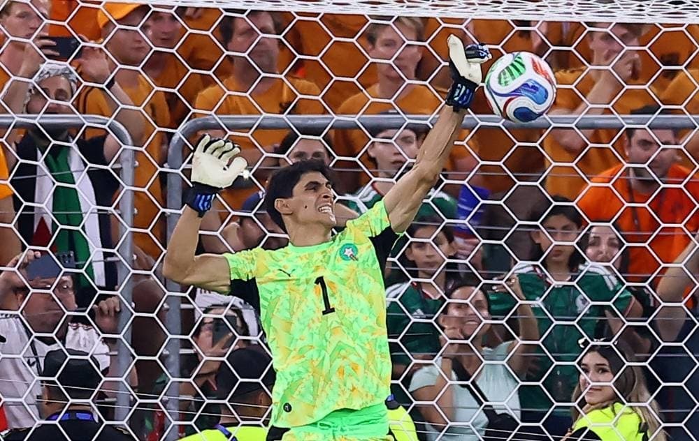 Yassine Bono celebrating after saving a penalty in the World Cup match against the Netherlands.
