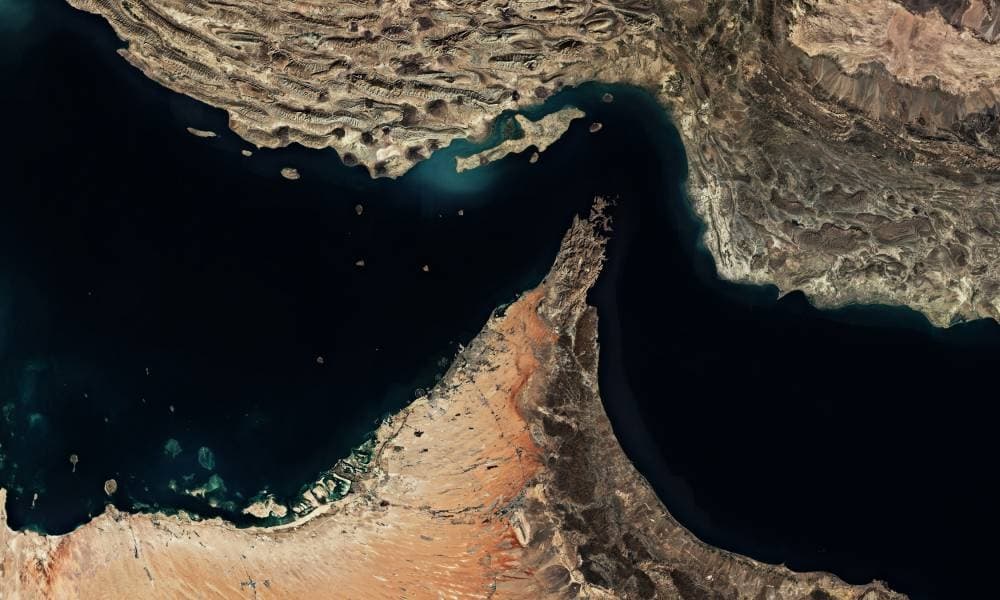 U.S. Navy ships patrolling the Strait of Hormuz amidst rising tensions with Iran.