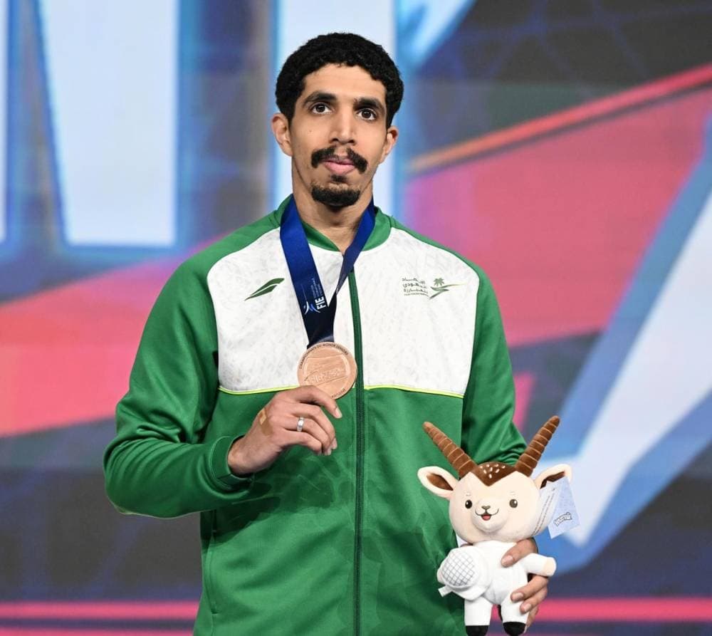 Khalifa Al-Amiri celebrating his bronze medal win at the World Fencing Championships