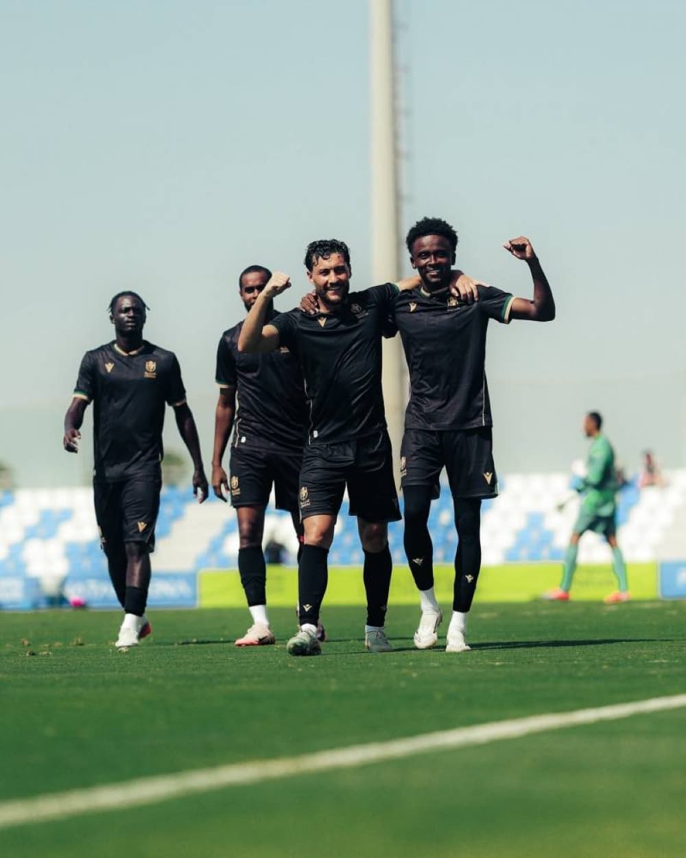 Al-Dhariyah team celebrating during a friendly match against Al Ain.