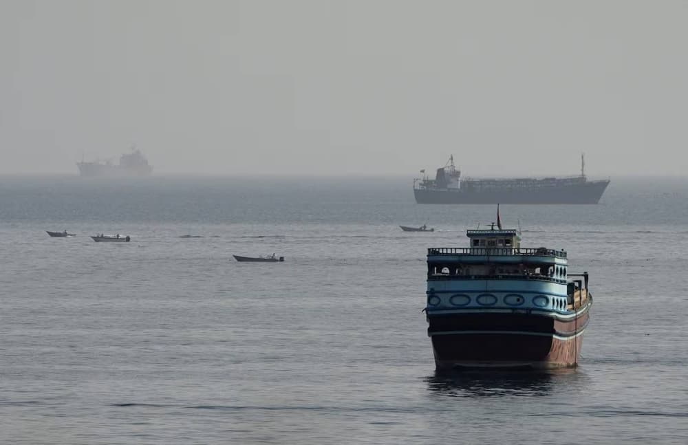 Infographic showing the decline in vessel transits through the Strait of Hormuz and rising oil prices.