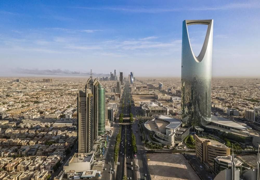 Infographic showing Saudi Arabia's rise in global competitiveness rankings and key reforms driving change.