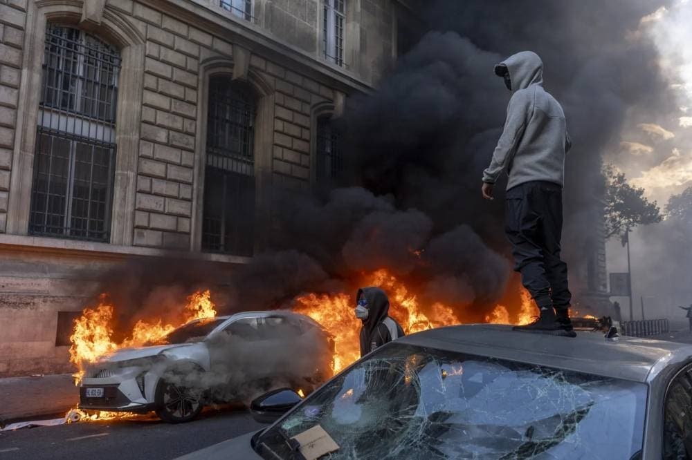 Protesters in France during unrest over living costs, highlighting political tensions and security challenges.