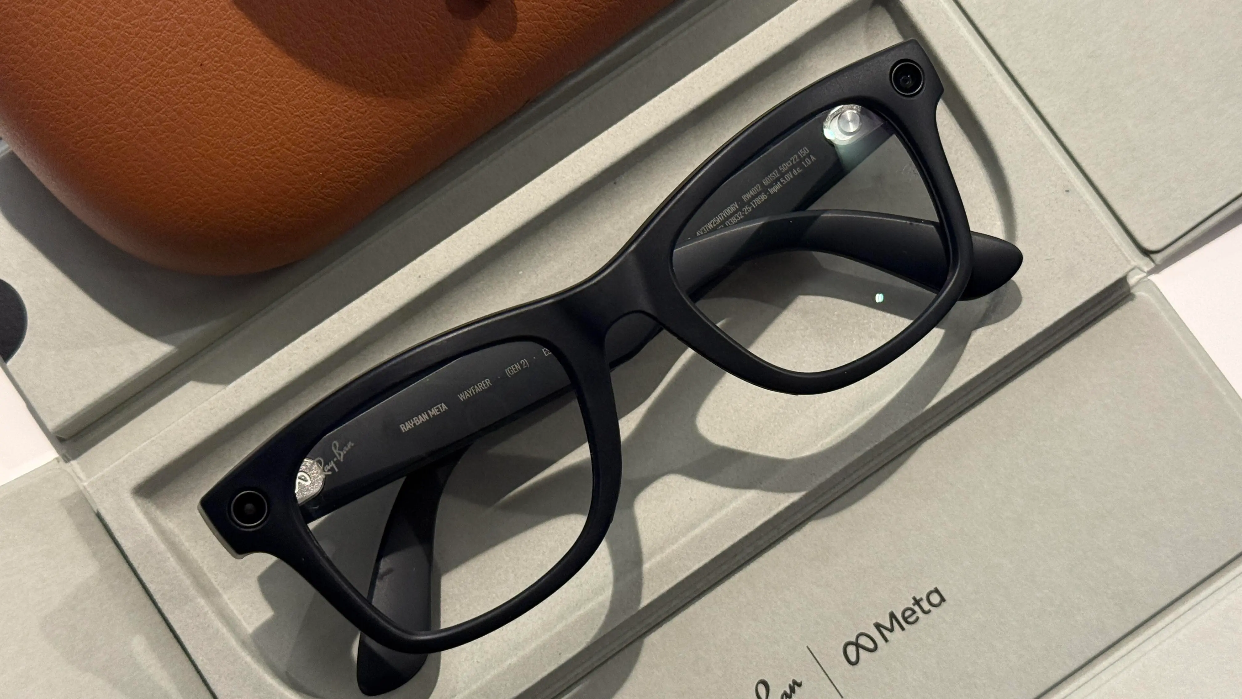 Infographic showing Meta's smart glasses firmware updates and privacy enhancements.