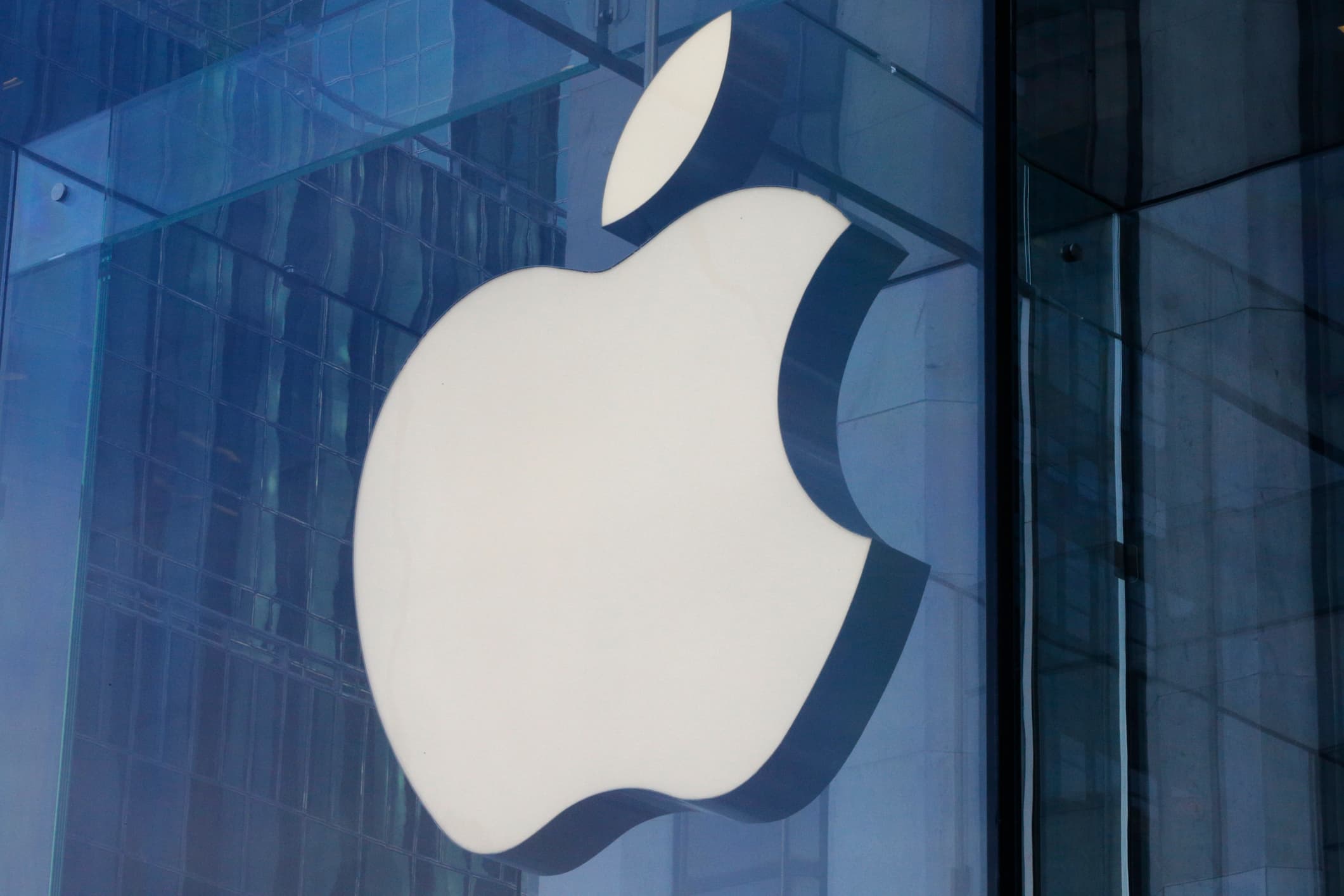 Apple logo with a warning symbol indicating cybersecurity threats