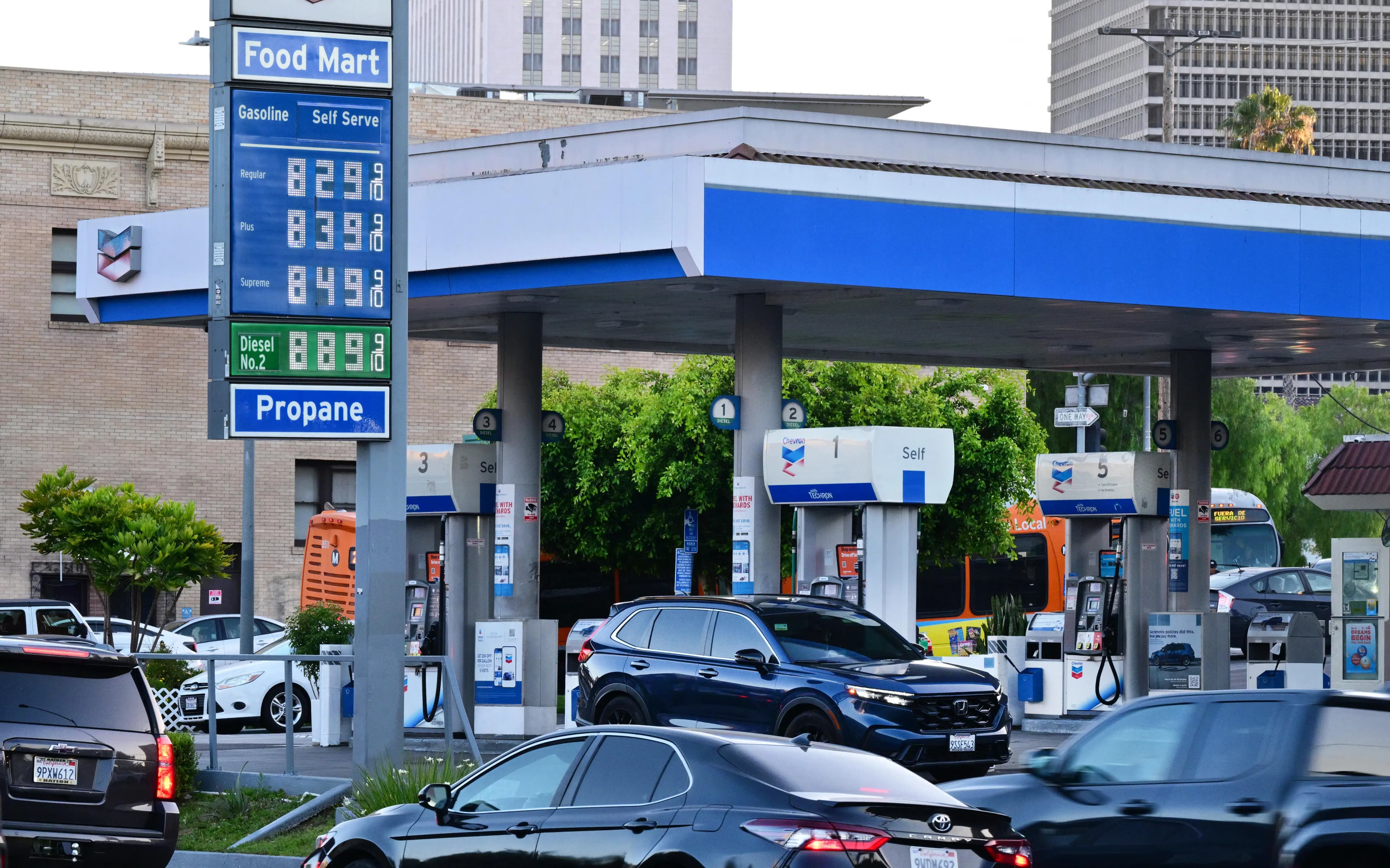 A chart comparing fuel economy standards and gasoline prices over time, highlighting the new CAFE standards.