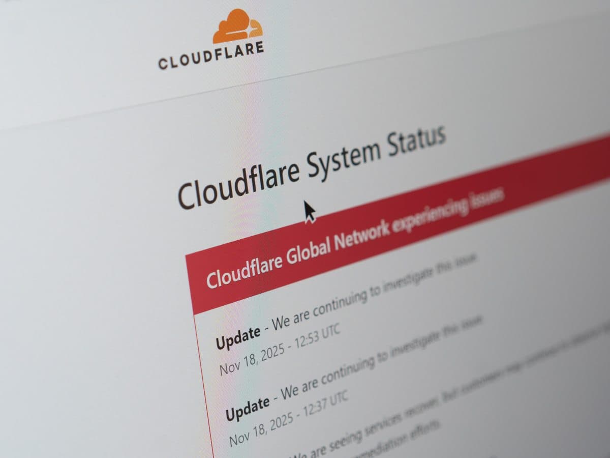 Cloudflare logo with a backdrop of a declining stock chart