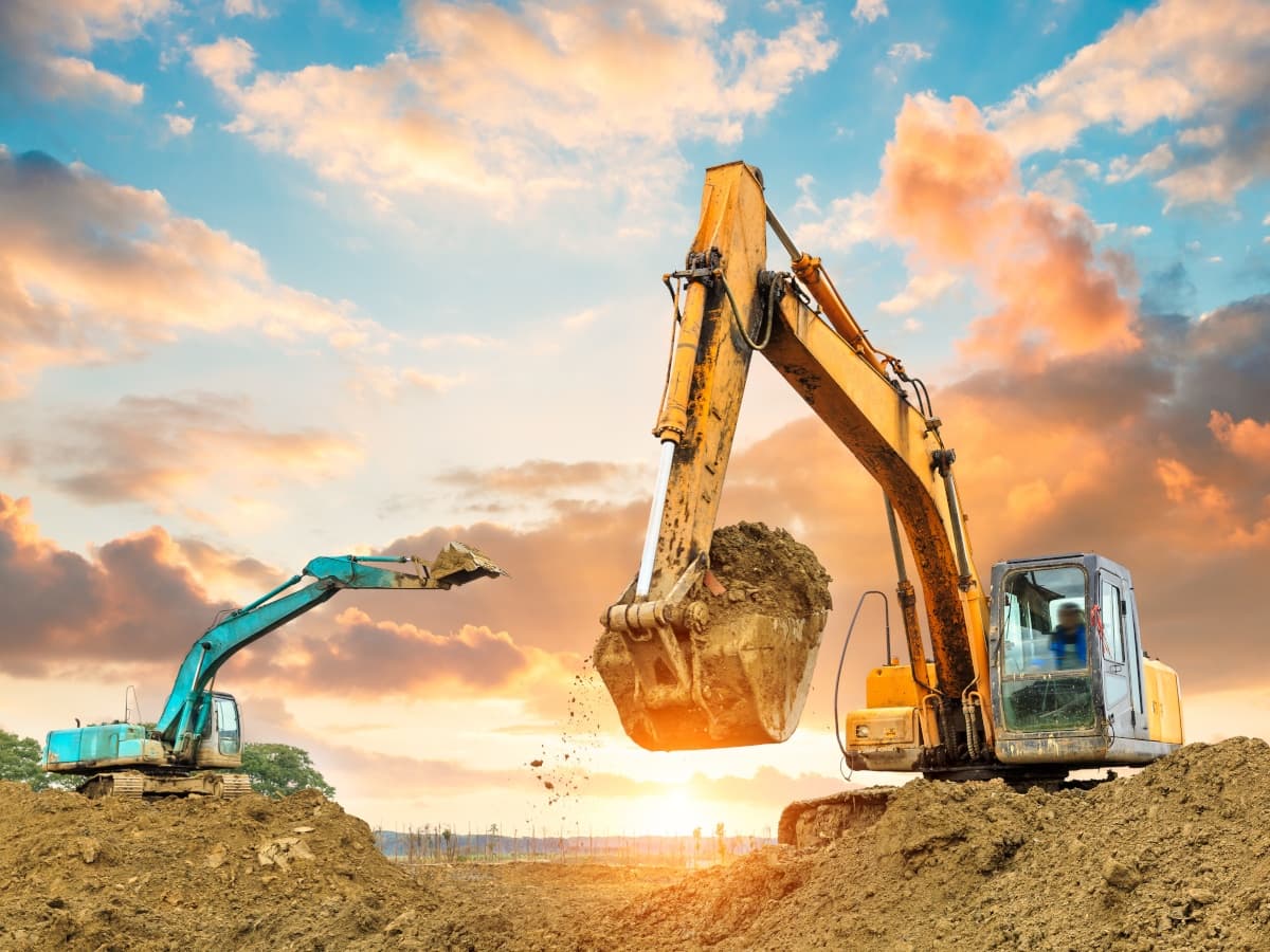 Gravis Robotics logo with construction machinery, highlighting the $200 million funding round and its impact on automation.