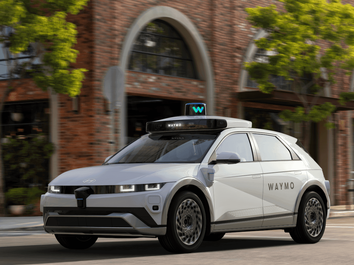 Infographic showing Waymo's custom 5nm ASIC performance metrics compared to traditional components.