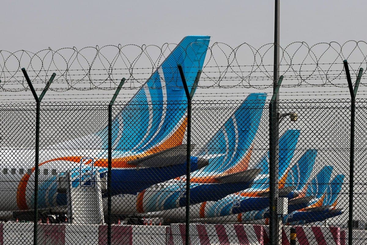 Flydubai aircraft at an airport with a focus on travel disruptions.