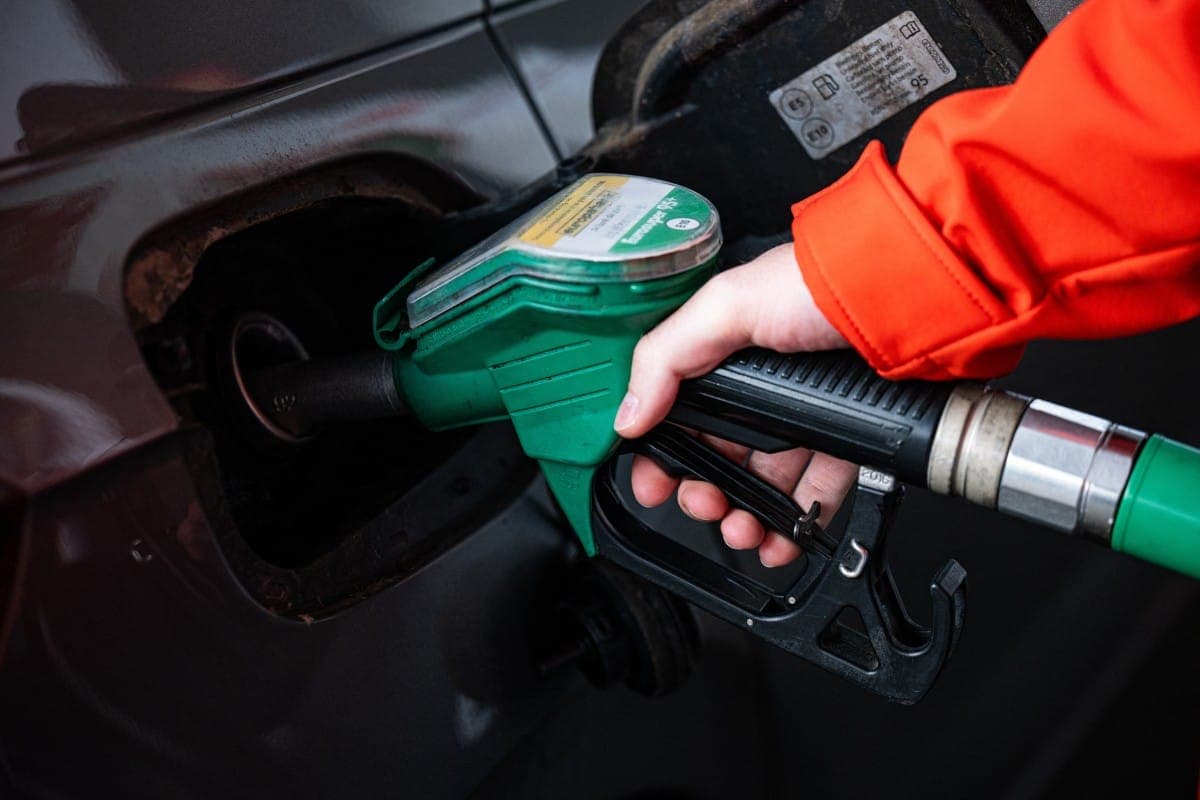 Illustration of gas station monitoring systems affected by cyber threats.