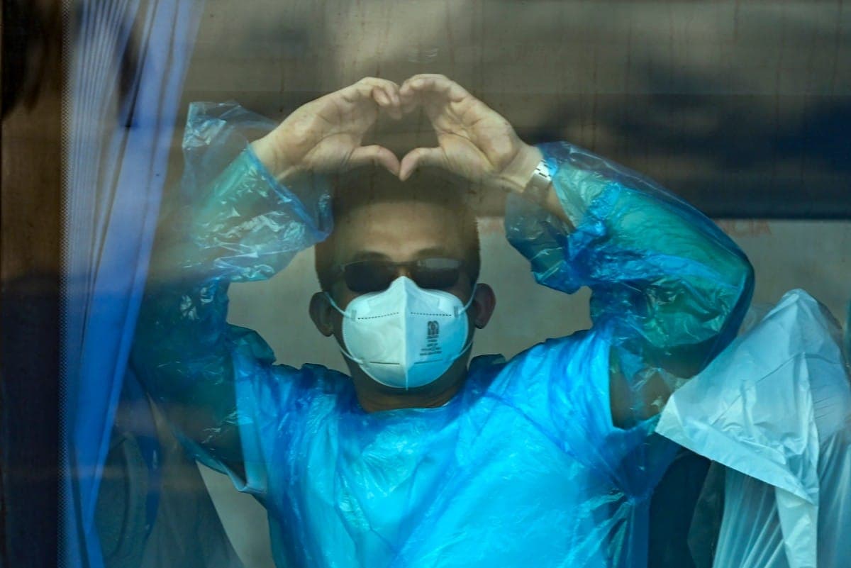 A medical professional monitoring a patient in intensive care due to hantavirus.