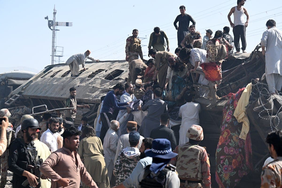 Emergency responders at the site of the train blast in Quetta, Pakistan.