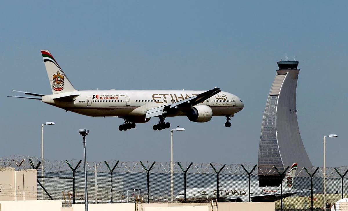 Etihad Airways aircraft at an airport during sunset.