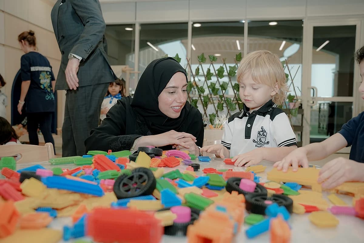 KHDA logo with a backdrop of Dubai's skyline and schools