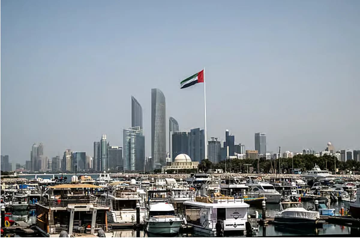 Infographic showing missile threats to UAE and trade suspension impact