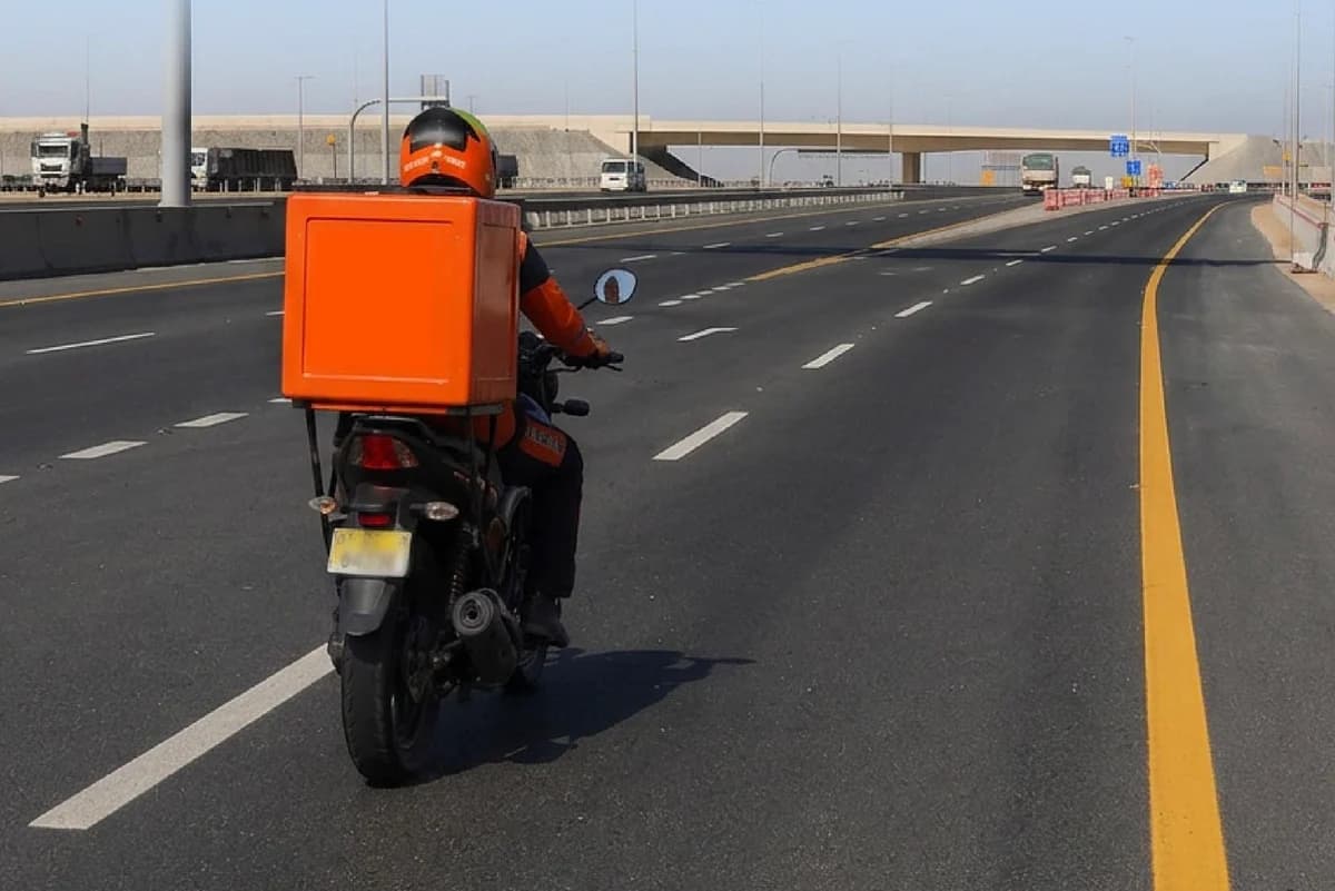 Delivery motorcycle on a high-speed road in Abu Dhabi