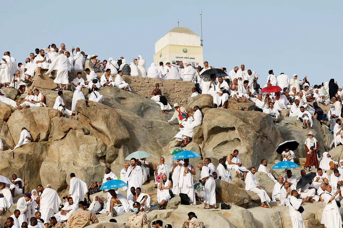 Pilgrims praying on the sacred plain of Arafat during Hajj.