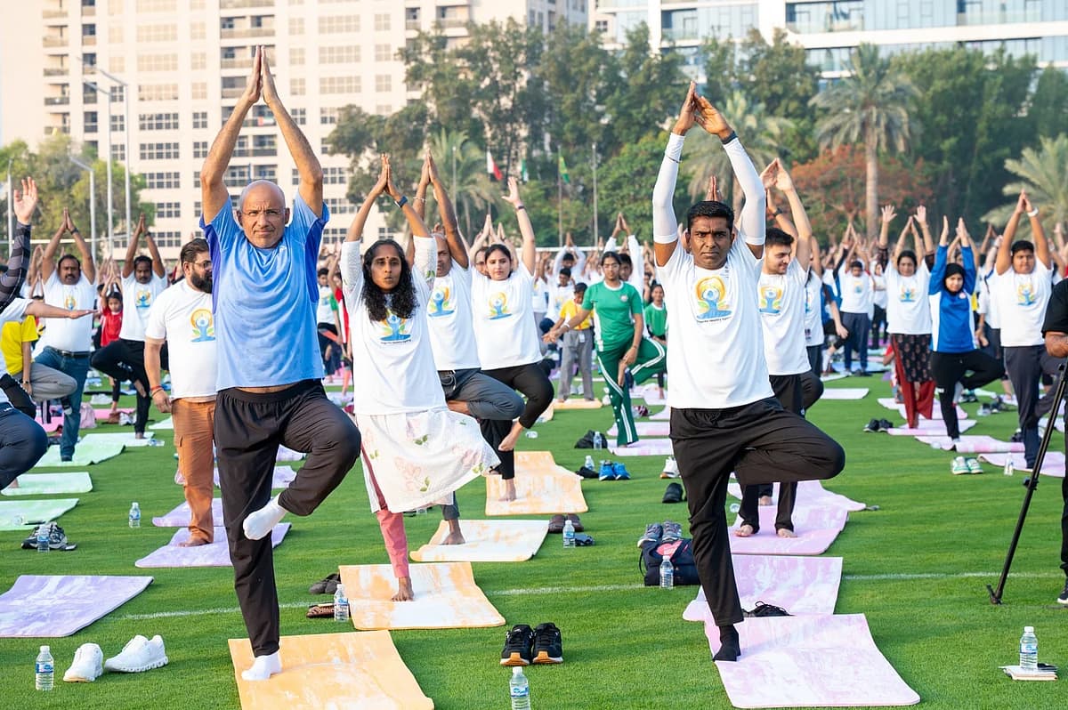 Participants engaging in yoga at Dubai Police Officers’ Club for International Yoga Day.