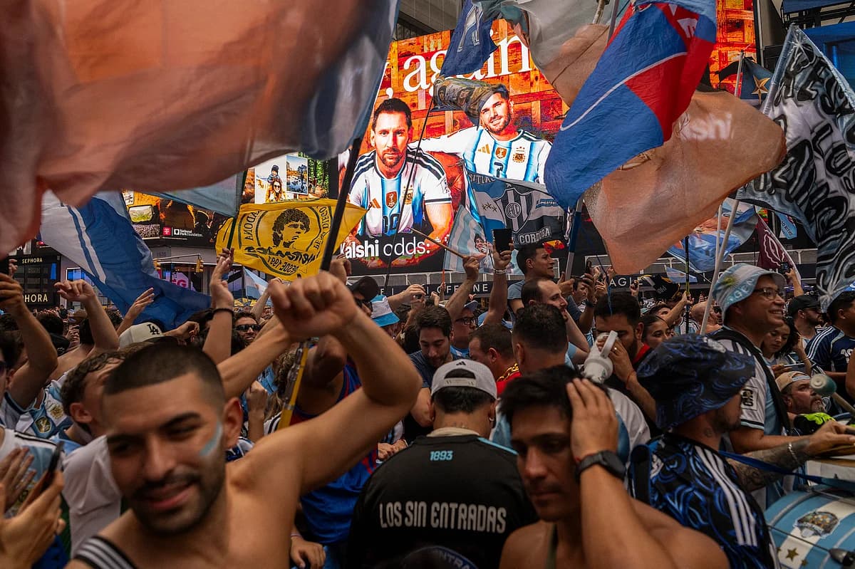 Fans celebrating the World Cup final in Dubai's fan zones.