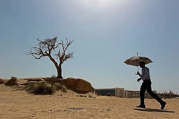 Abu Dhabi skyline under extreme heat conditions