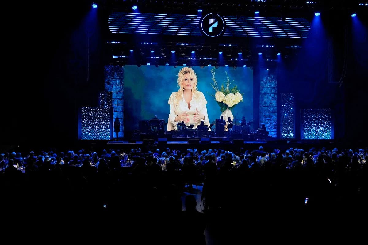 A tribute image of Dolly Parton with a quote about legacy, highlighting her impact on country music and culture.
