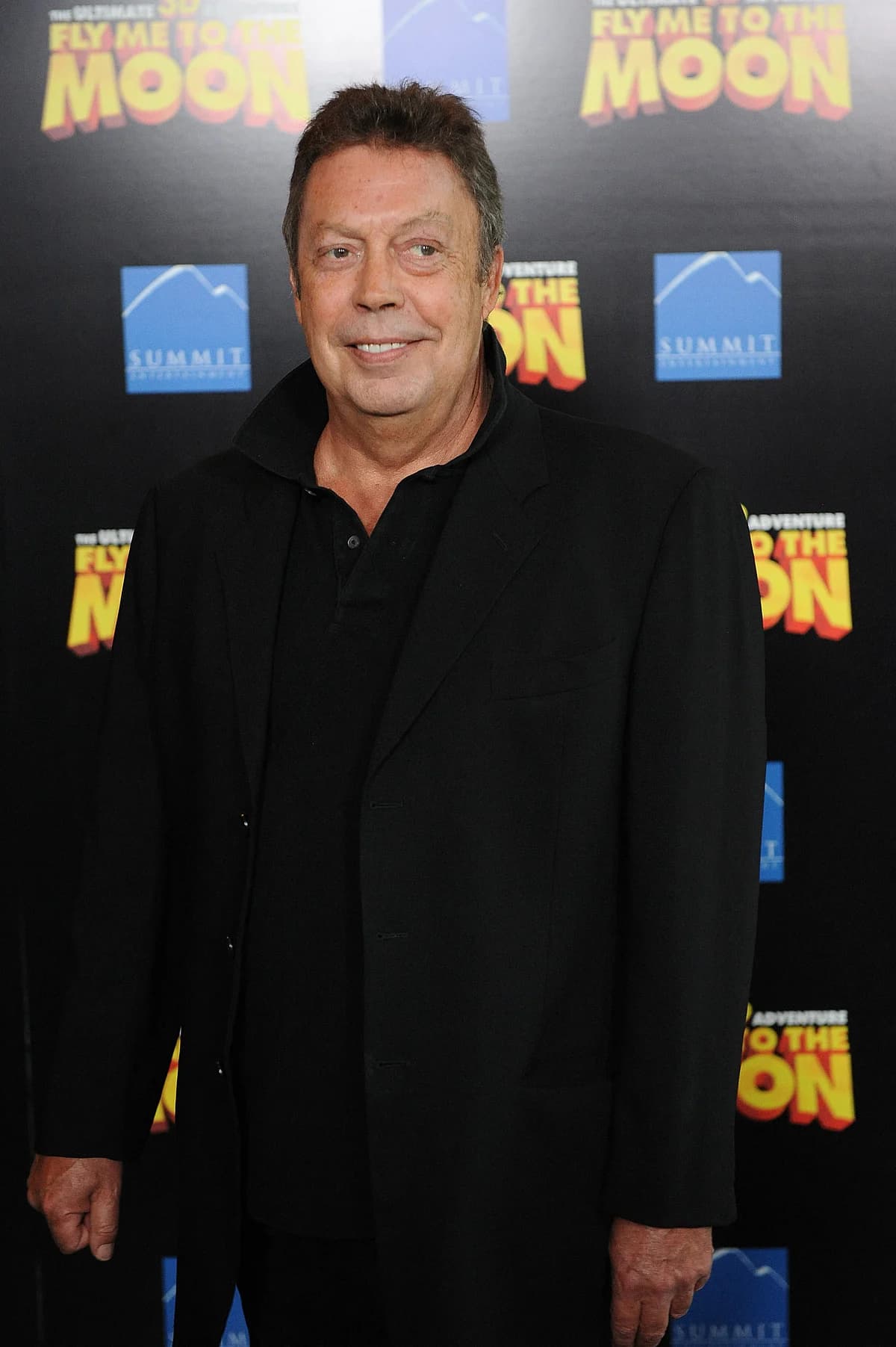Tim Curry as Dr. Frank-N-Furter, showcasing his iconic flamboyant style and charisma.