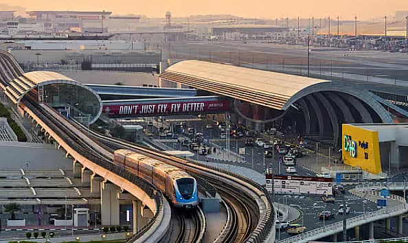 Infographic showing Dubai Police securing 95.2 million passengers at DXB using AI technology.