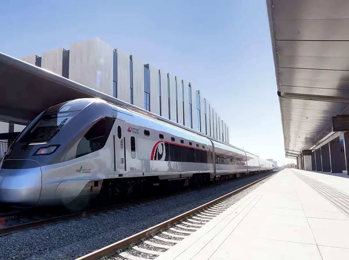 A train traveling between Abu Dhabi and Dubai, highlighting the new Etihad Rail weekend services.