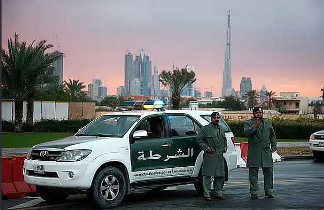 A family photo with the Dubai Police emblem, representing community support after a mother's death during childbirth.