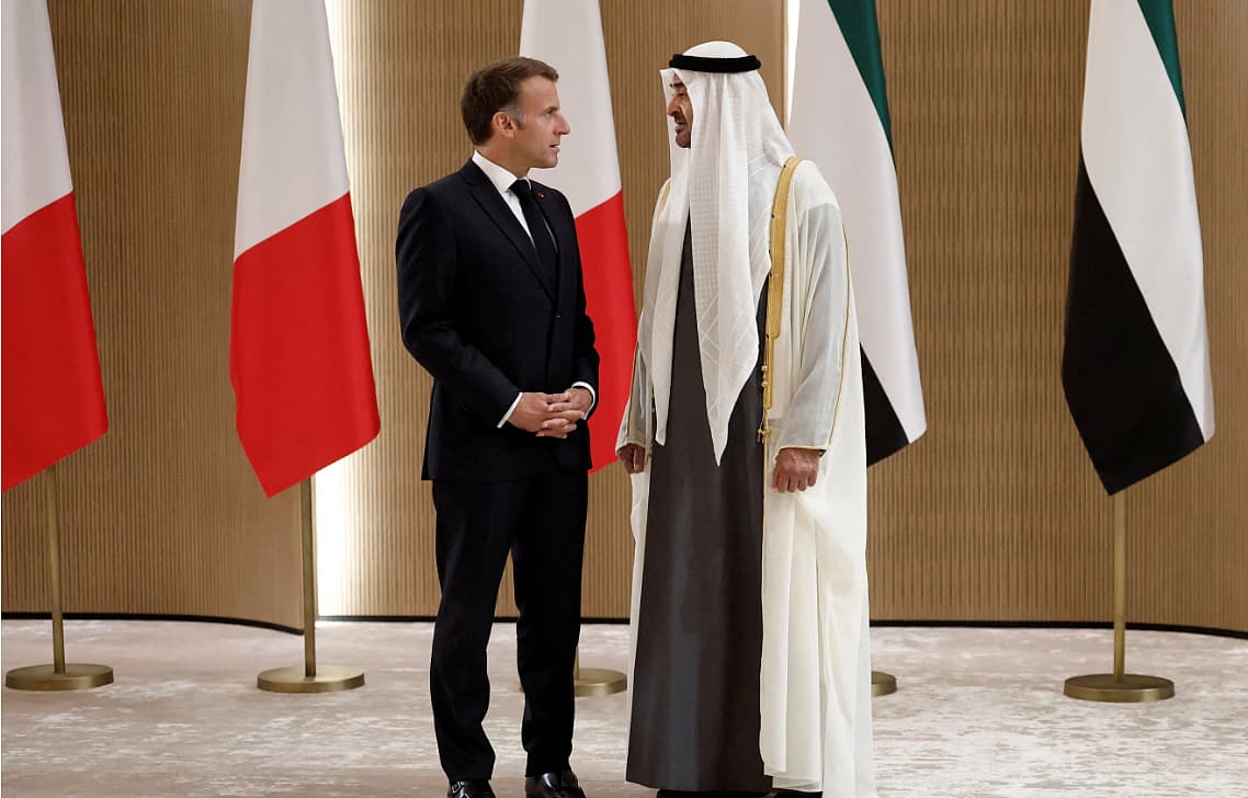 French President Macron and UAE President Al Nahyan discussing energy security and technology partnerships in Abu Dhabi.