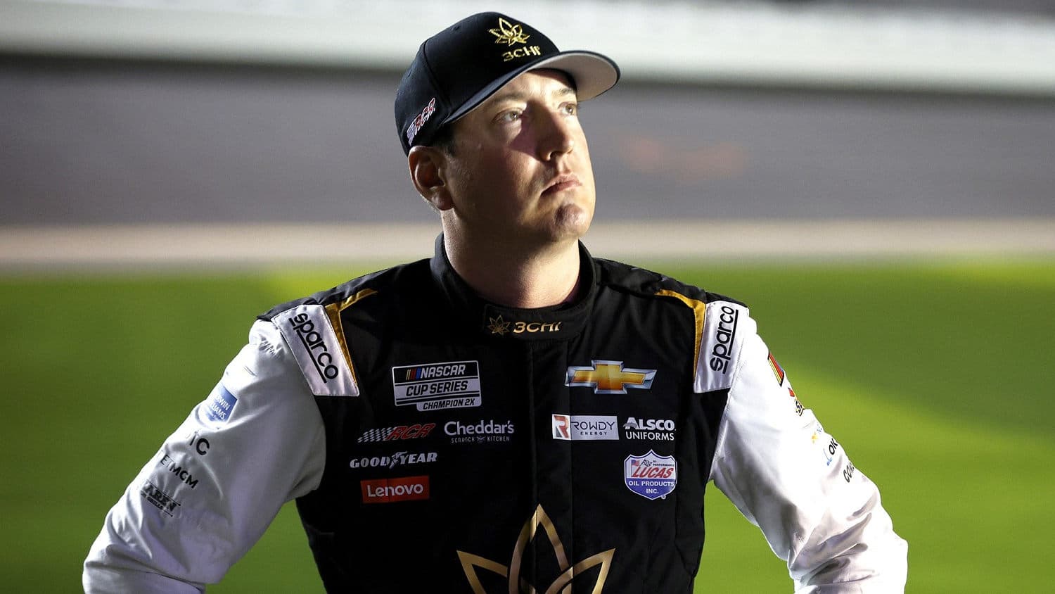 Kyle Busch celebrating a victory in NASCAR racing.