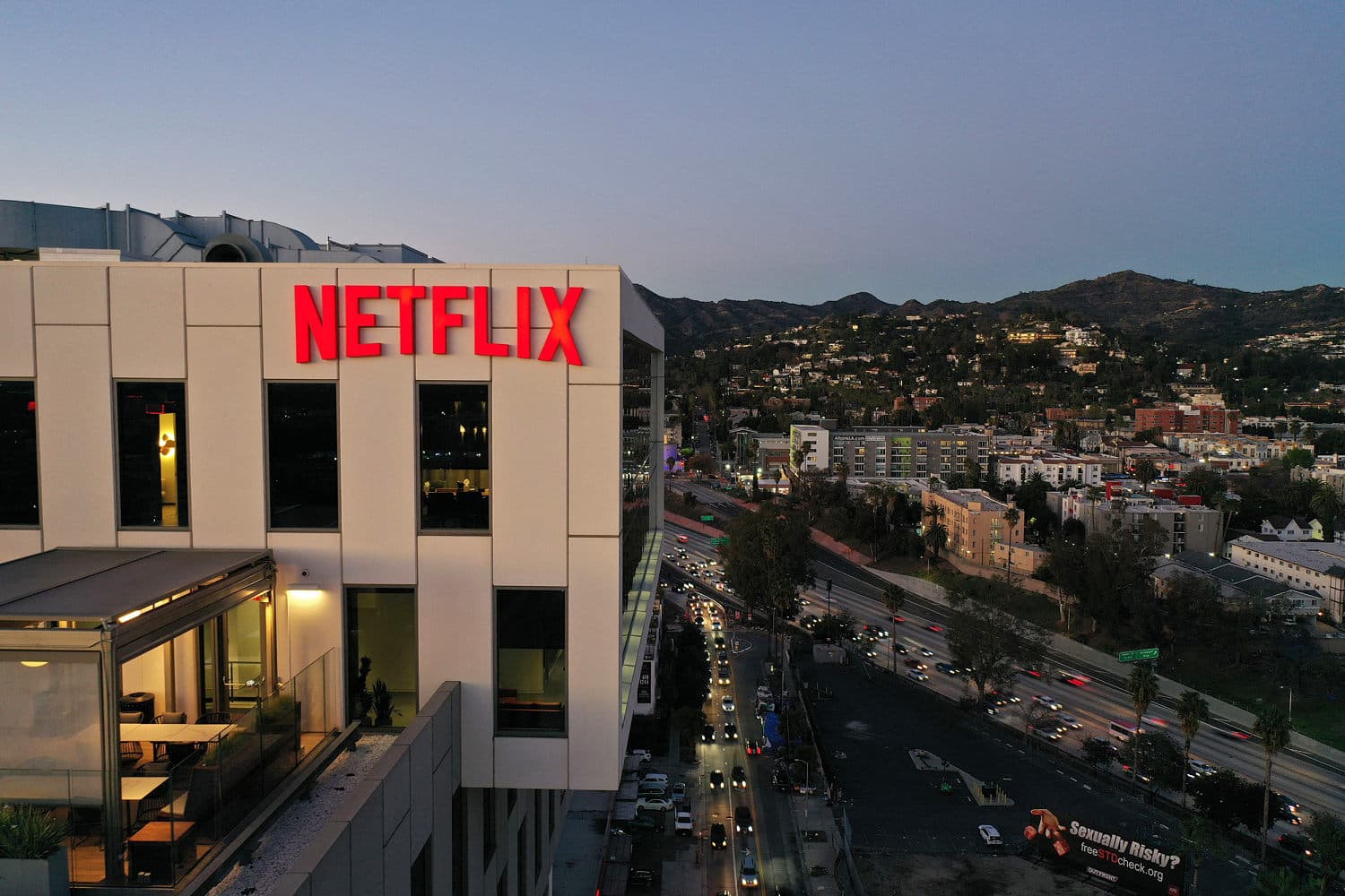 Infographic showing Netflix's Q3 2026 revenue growth, stock price changes, and workforce reductions.
