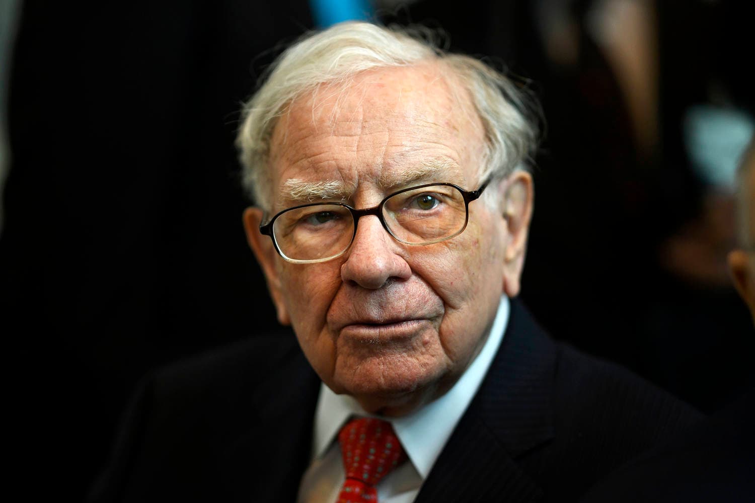 Warren Buffett announcing his transition to chairman emeritus at Berkshire Hathaway, highlighting leadership changes.
