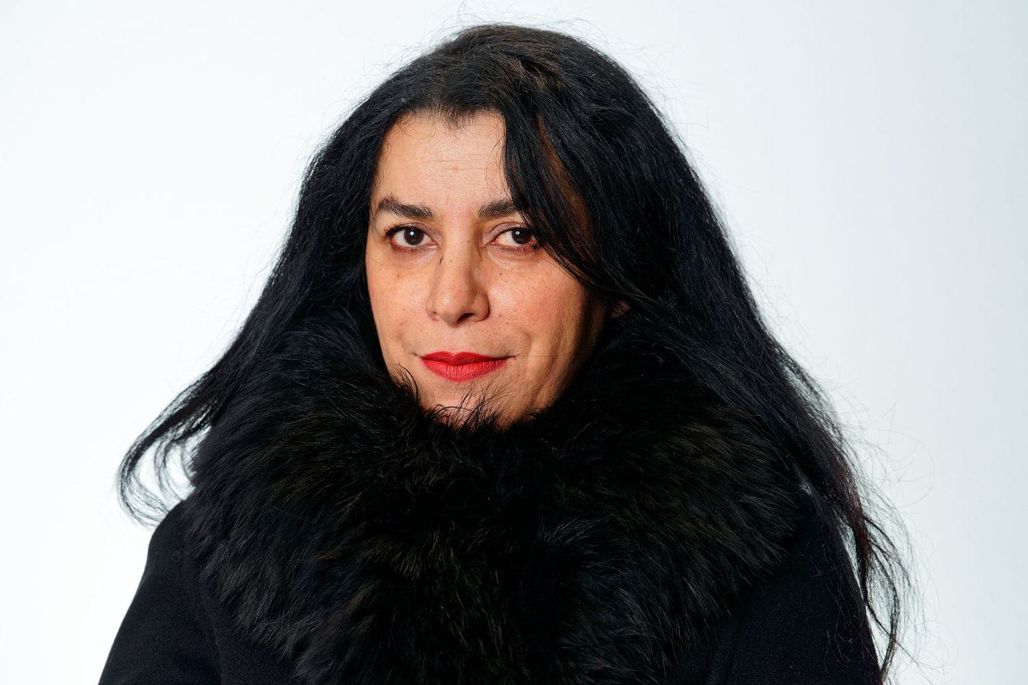 Portrait of Marjane Satrapi with a quote from 'Persepolis' highlighting her advocacy for women's rights.