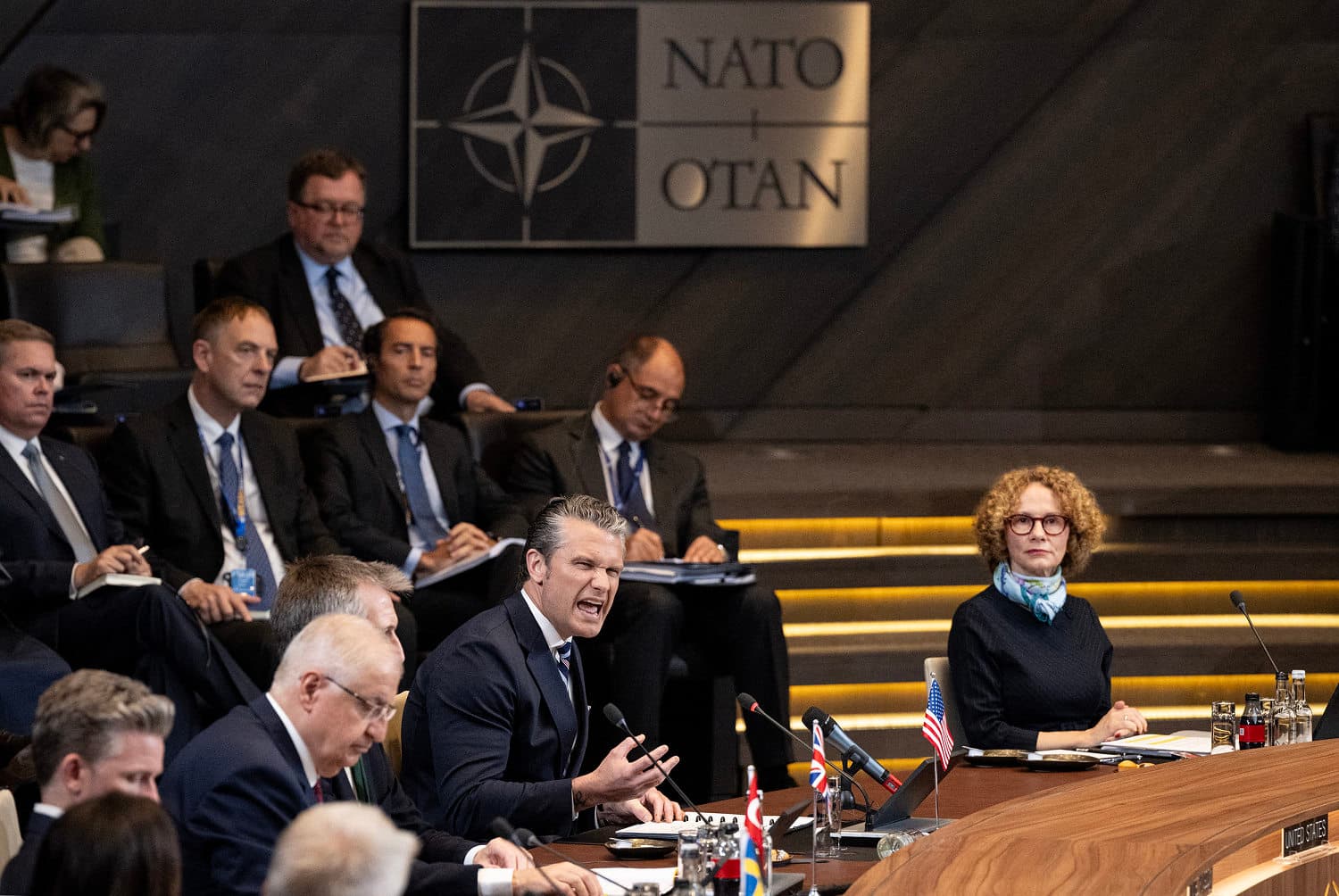 U.S. Defense Secretary Hegseth addressing NATO allies about military commitments and defense spending.