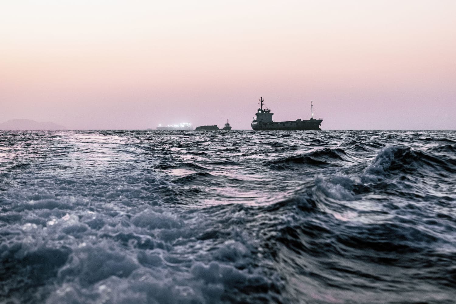 Oil tankers navigating the Strait of Hormuz amidst geopolitical tensions.