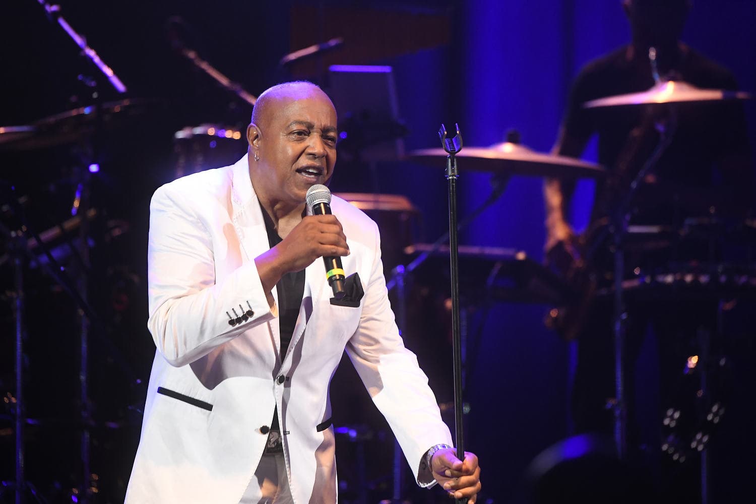 Peabo Bryson performing on stage, celebrating his musical legacy.
