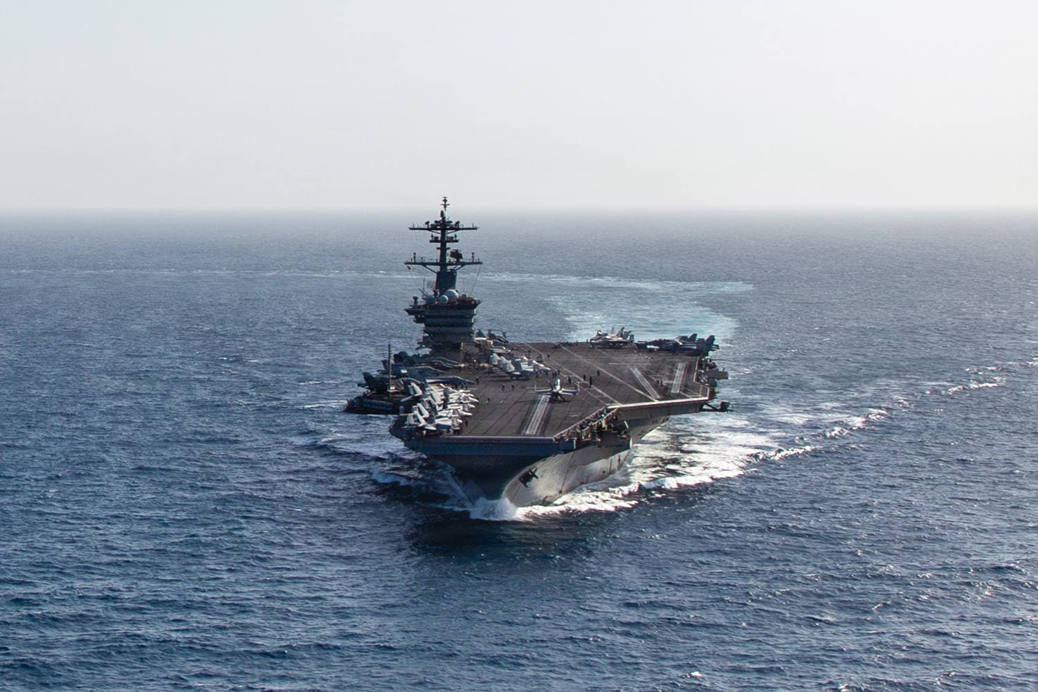 Infographic showing the timeline of USS Abraham Lincoln's deployment and mental health resources available to crew members.