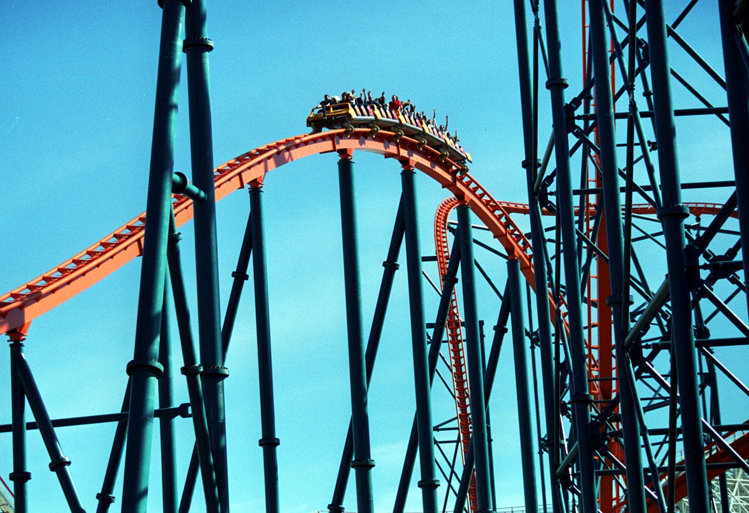 Clean graphic card displaying 220-plus operational coasters for Six Flags seat belt updates