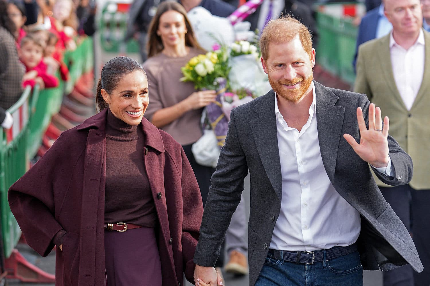 Prince Harry and Meghan Markle interacting with fans during their charity visits in Nottingham.