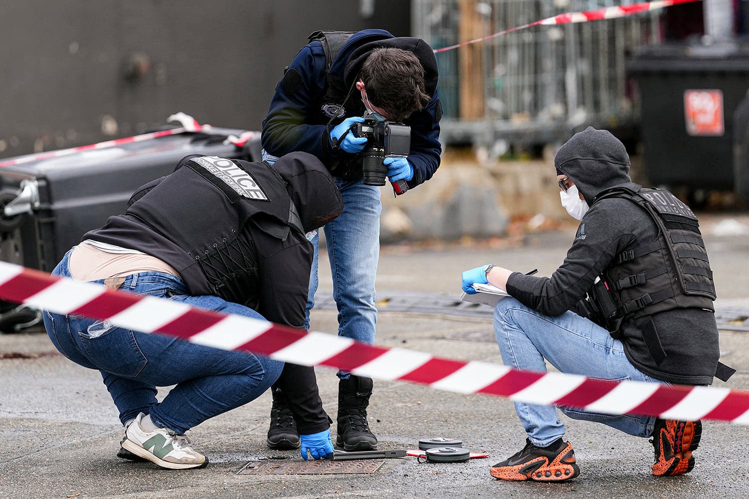 A petrol station in Trappes, France, marked by police tape after a racially motivated shooting incident.