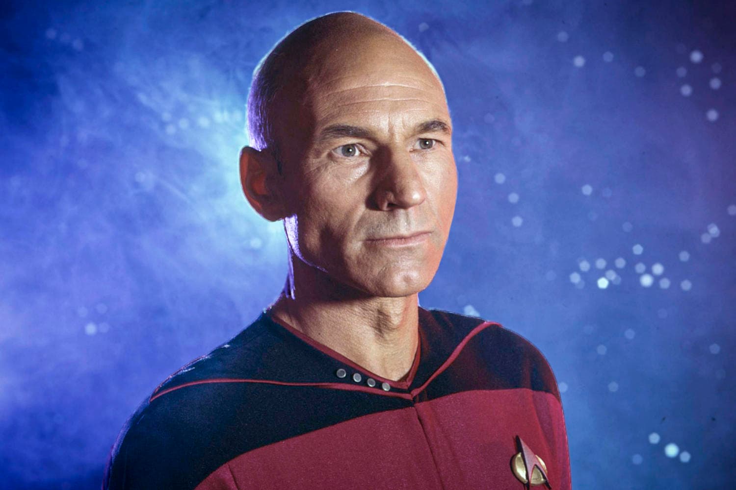 Minimalist black background displaying white typography honoring Sir Patrick Stewart's 60-year acting legacy