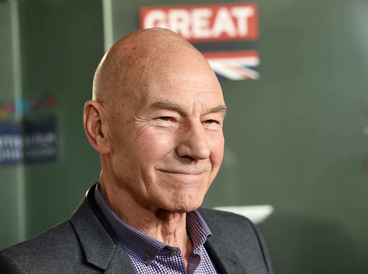 Minimalist black and white portrait tribute card honoring actor Sir Patrick Stewart at age 86