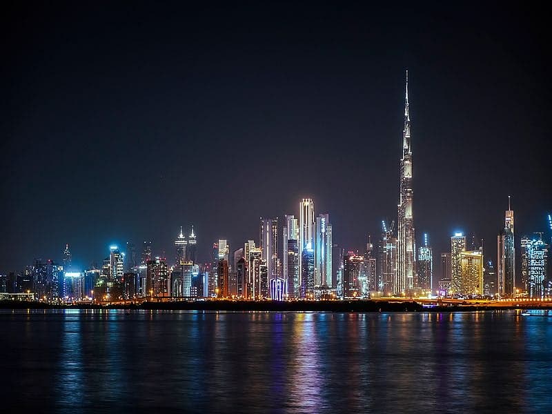 Dubai skyline with digital technology overlay representing smart city innovations.