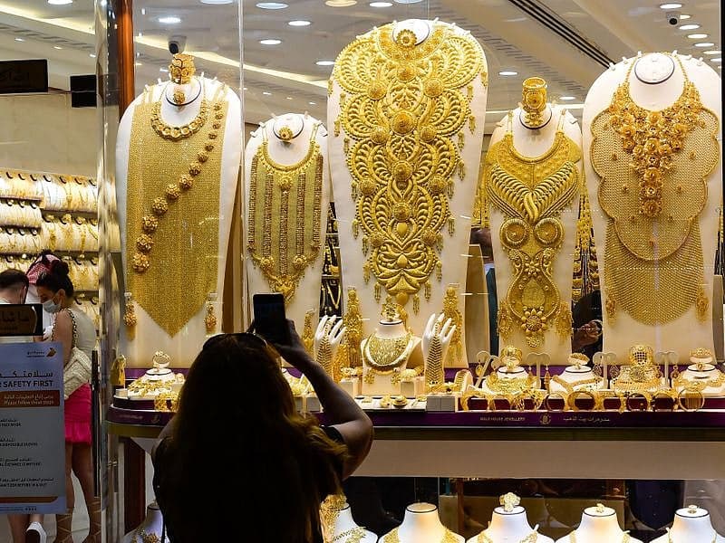 A close-up of gold bars and jewelry reflecting current market trends.